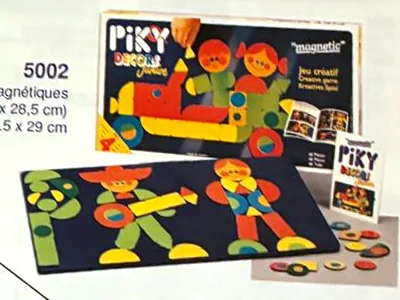 Ardoise Piky Decors Junior de 1990 : deux bonshommes composés de pièces aimantées, boîte derrière